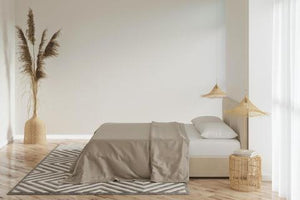 A modern bedroom with bamboo bed sheets in grey
