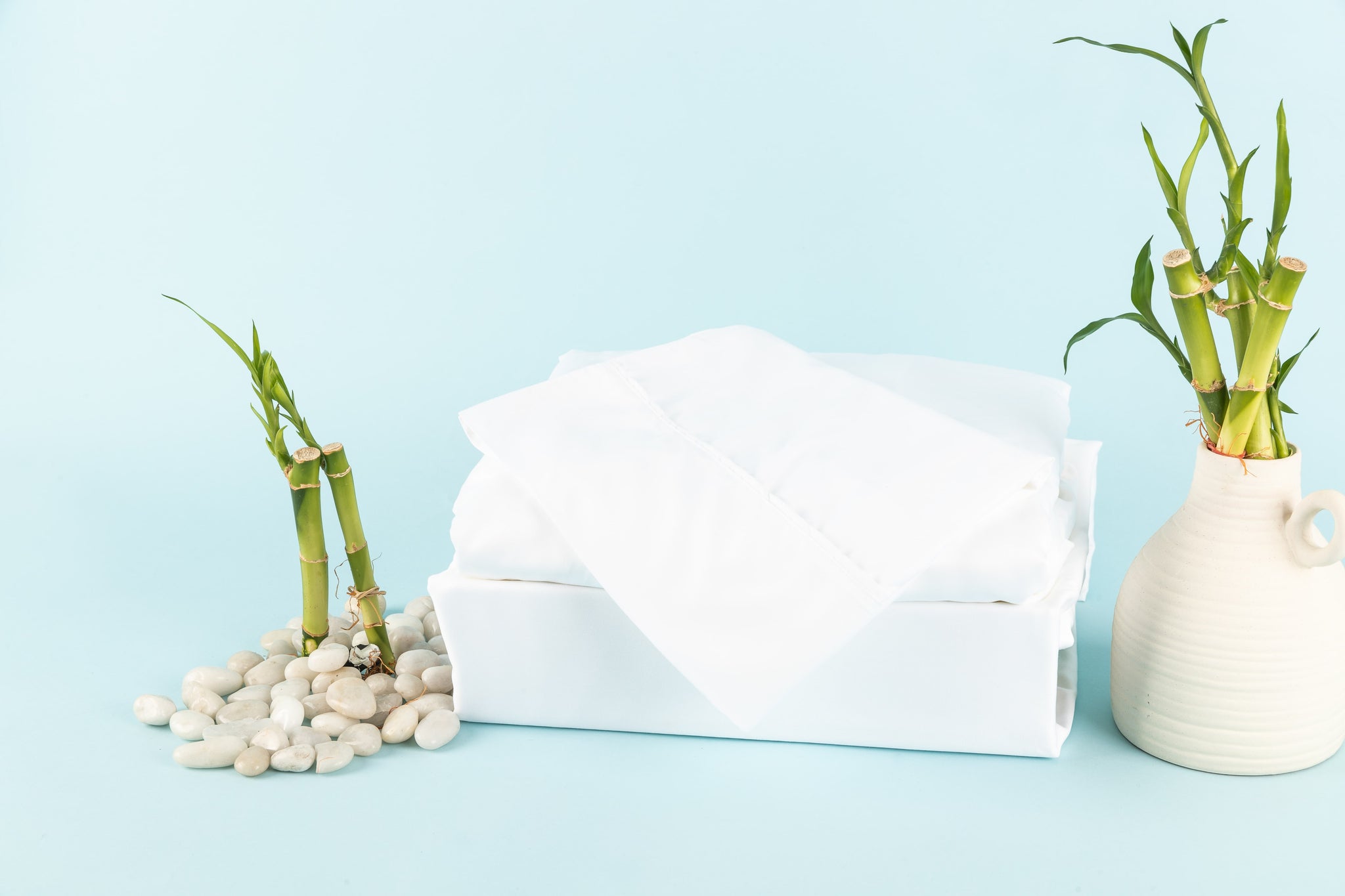 Bamboo Bed Sheets in White, with a Blue background