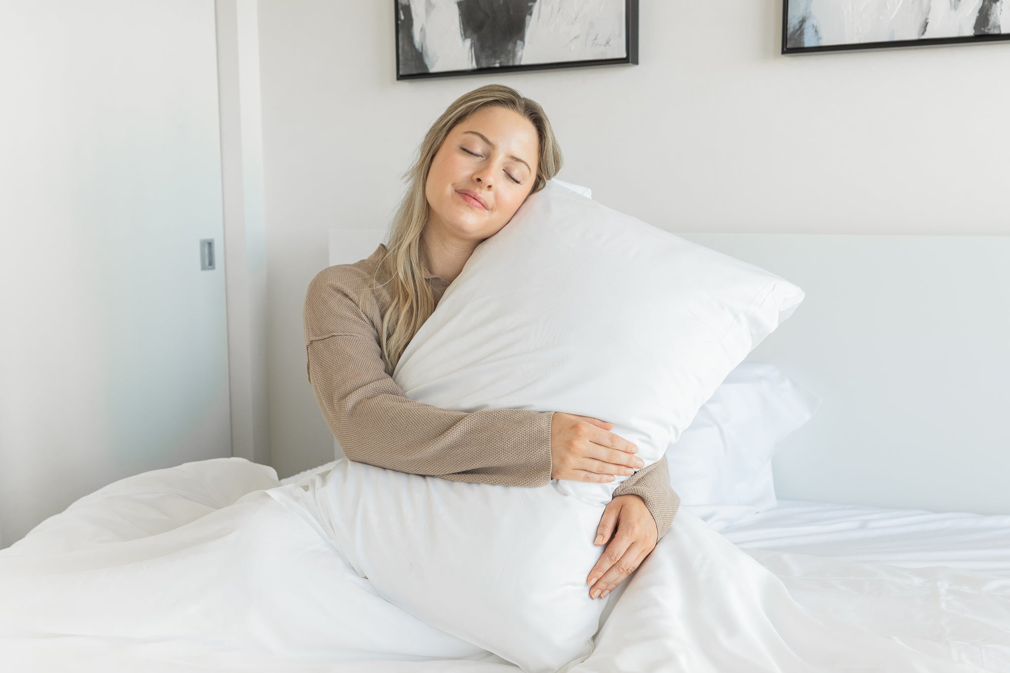 A Canadian using Snoozy Monk Bamboo Bed Sheets on a white bed