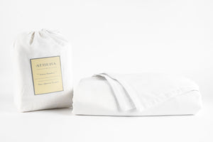An Athena Bamboo Linen Sheet Set in White with package