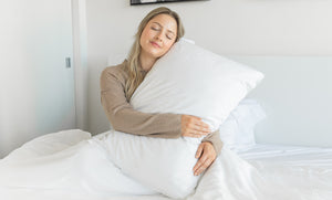 A Canadian Woman on Snoozy Monk Bamboo Bed Sheets in a White bedroom setting