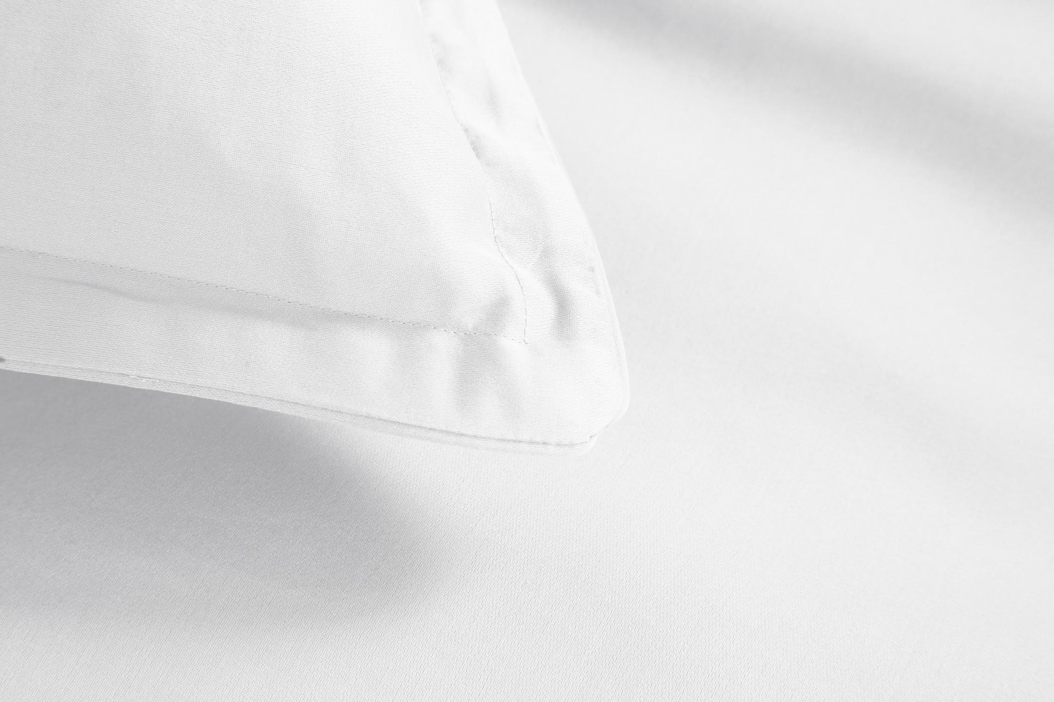 A white snoozy monk bamboo pillow sham showing flange