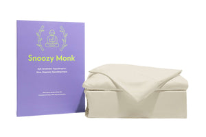 A cream Snoozy Monk Rayon Bamboo Sheet Set with box